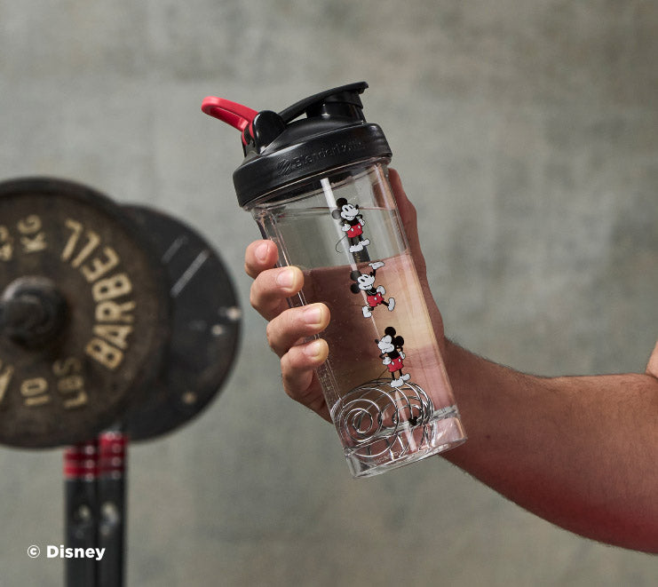 pro-series-v4 Mickey_Mouse_Protein_Shaker_Bottle_Being_Held_In_the_Gym.jpg